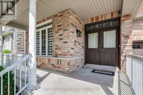 Vaughan (Vellore Village) apartment for rent - A house with a brown door and a brick wall.
