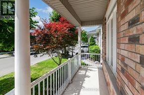 Vaughan (Vellore Village) apartment for rent - A view of a porch with a tree with red leaves.