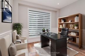Vaughan (Vellore Village) apartment for rent - A modern home office with a black desk and a white chair.