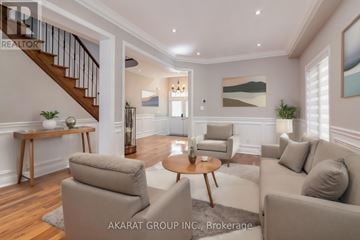 Vaughan (Vellore Village) apartment for rent - A living room with a staircase and a painting on the wall.