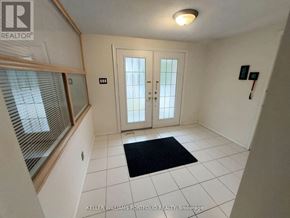 Markham (Royal Orchard) apartment for rent - A hallway with a black doormat in front of a white door.