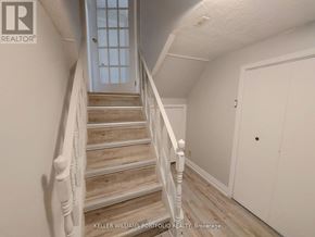 Markham (Royal Orchard) apartment for rent - A staircase with a white railing and wooden steps.