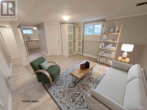 Markham (Royal Orchard) apartment for rent - A living room with a white couch, a green chair, and a coffee table.