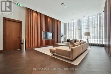 Vaughan (Concord) condo for rent - A living room with a couch and a television set.