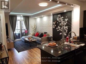 Vaughan (Maple) condo for rent - A modern kitchen and living room with a dining table and chairs.