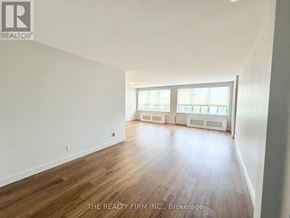 London South (South F) condo for rent - A room with wooden flooring and white walls.