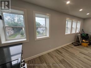 Fort Erie (Central) multi-family for rent - A room with a window and a vacuum cleaner on the floor.