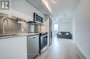 Toronto (Clanton Park) condo for rent - A modern kitchen with stainless steel appliances and a microwave mounted above the oven.