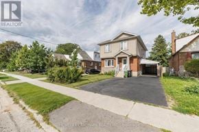 Toronto (Dorset Park) apartment for rent - A large house with a driveway in front of it.