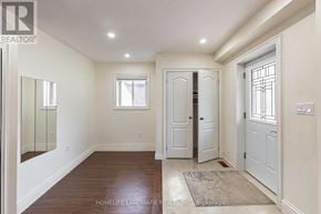 Toronto (Dorset Park) apartment for rent - A hallway with a wooden floor and white walls.
