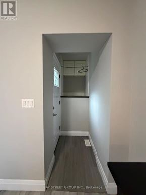 Toronto (Annex) apartment for rent - A hallway with a coat rack and a light switch.