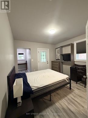 Toronto (Annex) apartment for rent - A bedroom with a bed, dresser, and mirror.