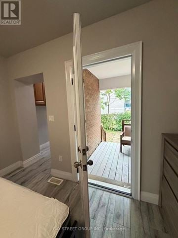 Toronto (Annex) apartment for rent - A bedroom with a bed and a door leading to a balcony.
