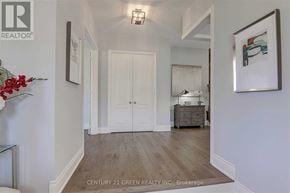 Oakville (Jm Joshua Meadows) apartment for rent - A hallway with a white door and a painting on the wall.