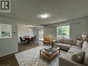 Cambridge apartment for rent - A living room with a grey couch, a coffee table, and a dining table with chairs.