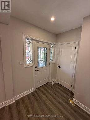 Hamilton (Gibson) apartment for rent - A room with a window and a door is shown.