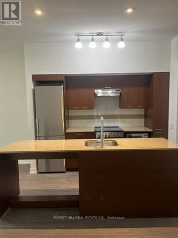 Toronto (Forest Hill South) house for rent - A kitchen with a sink and a refrigerator.