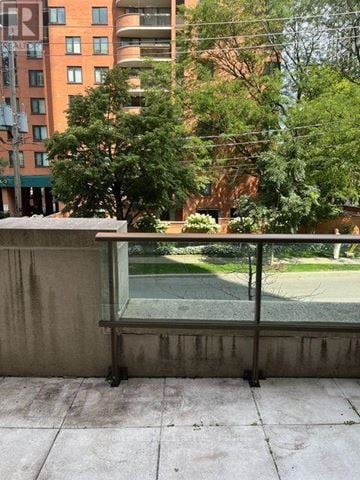 Toronto (Forest Hill South) house for rent - A balcony with a view of a green lawn and trees.