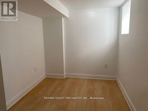 Mississauga (East Credit) apartment for rent - A room with wooden flooring and white walls.