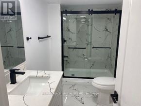 Mississauga (East Credit) apartment for rent - A bathroom with a marble sink and toilet.