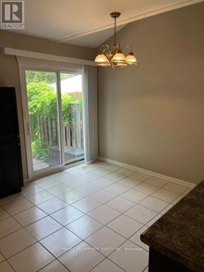 Burlington (Roseland) townhouse for rent - A realtor photo of a room with sliding glass doors.