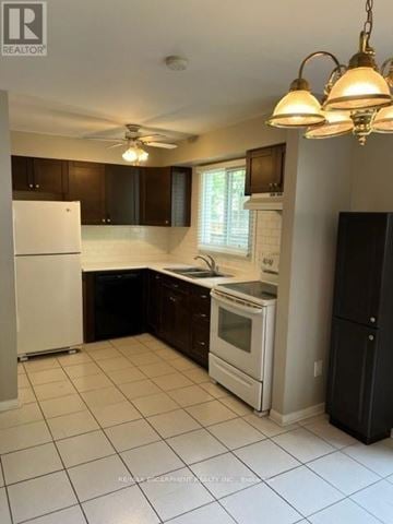 Burlington (Roseland) townhouse for rent - A kitchen with white appliances and brown cabinets.