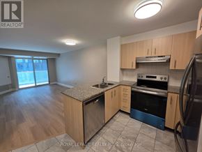 Toronto (Church-Yonge Corridor) condo for rent - A kitchen with wooden cabinets and a granite countertop.