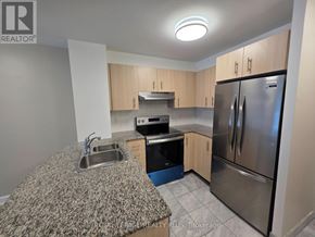 Toronto (Church-Yonge Corridor) condo for rent - A kitchen with a granite counter top and stainless steel appliances.