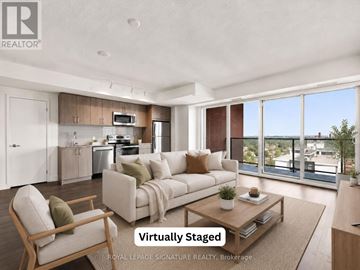 Toronto (Humber Heights) condo for rent - A modern living room with a kitchen in the background and a couch in the foreground.