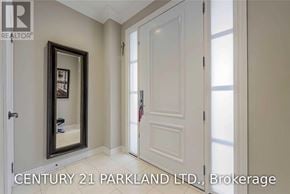 Vaughan (Vellore Village) townhouse for rent - A hallway with a mirror and a door leading to a window.