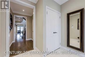 Vaughan (Vellore Village) townhouse for rent - A hallway with a white door and a mirror on the wall.