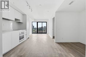 Toronto (Thorncliffe Park) condo for rent - A spacious, well-lit kitchen and living room with a view of the city.