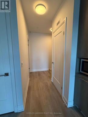 Markham (Unionville) condo for rent - A hallway with a light on the ceiling and a door on the left.