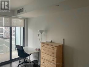 Toronto (Bay Street Corridor) condo for rent - A room with a desk, chair, and a dresser.