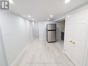 Toronto (Greenwood-Coxwell) apartment for rent - A white door is on the right side of the image.