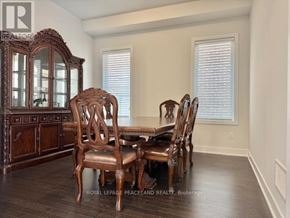 Aurora apartment for rent - A dining room with a wooden table and chairs.