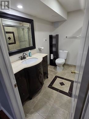 Barrie (Letitia Heights) apartment for rent - A bathroom with a sink, toilet and mirror.