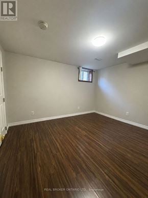Barrie (Letitia Heights) apartment for rent - A room with wooden flooring and a window.