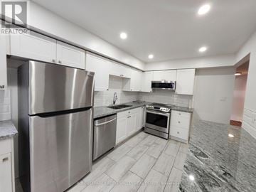 Mississauga (Erindale) townhouse for rent - A kitchen with a stainless steel refrigerator and a marble floor.