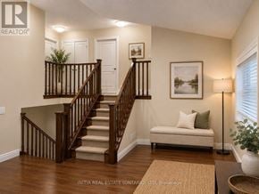 London North (North H) apartment for rent - A living room with a staircase and a couch.