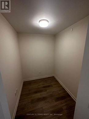 Hamilton (Beasley) condo for rent - A room with wooden flooring and white walls.