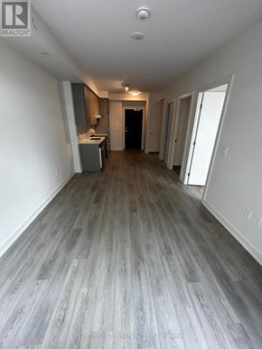 Hamilton (Beasley) condo for rent - A long hallway with wood floors and white walls.