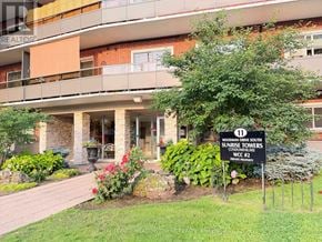 Hamilton (Corman) condo for rent - A sign in front of a building that says Woodman Drive South.