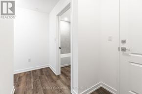 Hamilton (Waterdown) condo for rent - A white door is open to a hallway.