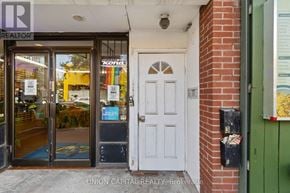 Toronto (Moss Park) multi-family for rent - A realtor office with a white door and a glass window.