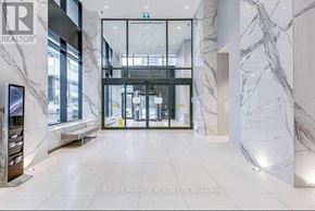 Toronto (Mimico) condo for rent - A hallway with marble walls and a realtor sign.
