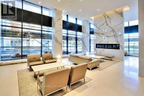 Toronto (Mimico) condo for rent - A spacious waiting area with beige chairs and a marble floor.