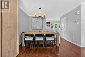 Ottawa condo for rent - A dining room with a wooden table and chairs.