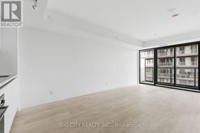 Toronto (Thorncliffe Park) condo for rent - A spacious room with a large window and a wooden floor.