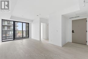 Toronto (Thorncliffe Park) condo for rent - A spacious room with a sliding glass door leading to a balcony.